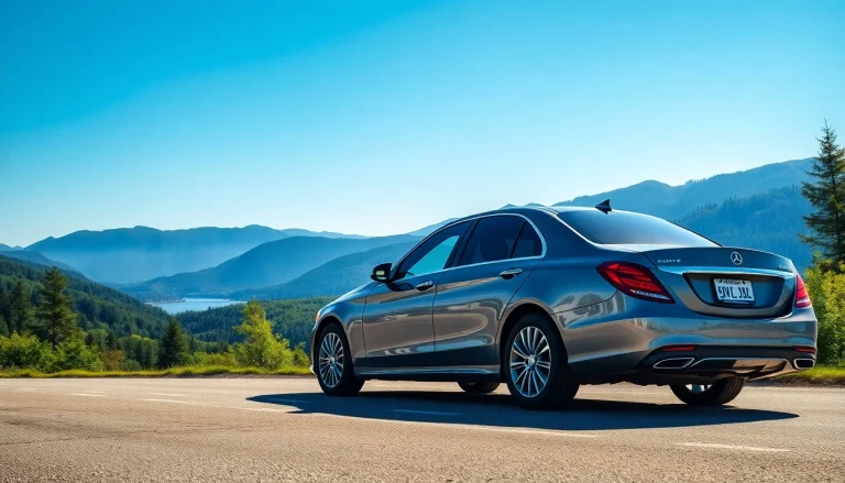 Car service from Vancouver to Seattle featuring a luxury sedan at a mountain viewpoint.